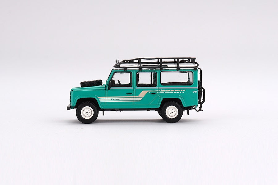 Mini GT - Land Rover Defender 110 1985 County Station Wagon Trident Green LDH - Scale 1/64 MGT00590