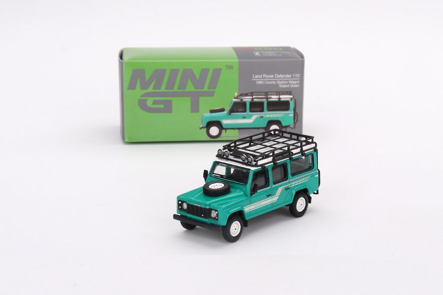 Mini GT - Land Rover Defender 110 1985 County Station Wagon Trident Green LDH - Scale 1/64 MGT00590